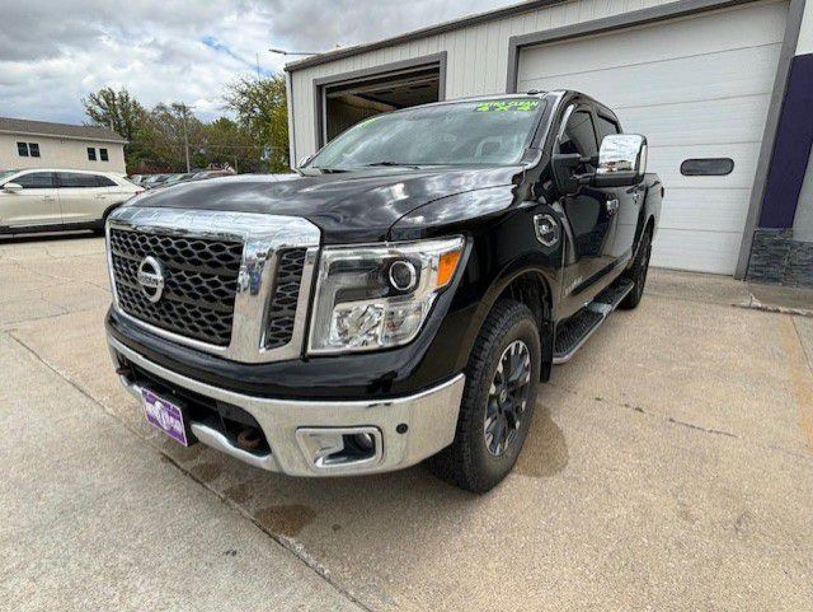 2017 BLACK NISSAN TITAN SV (1N6AA1E52HN) with an 5.6L engine, Automatic transmission, located at 1100 W. Sheridan Ave., Shenandoah, 51601, (712) 246-1600, 40.765678, -95.388817 - Photo #0