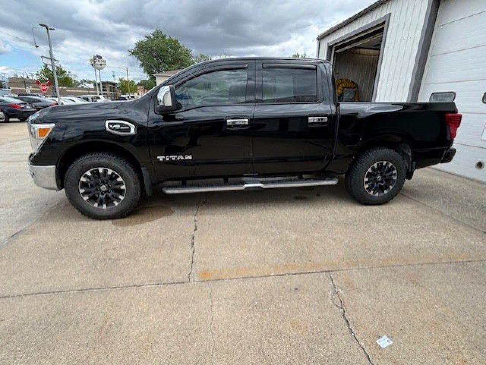 2017 BLACK NISSAN TITAN SV (1N6AA1E52HN) with an 5.6L engine, Automatic transmission, located at 1100 W. Sheridan Ave., Shenandoah, 51601, (712) 246-1600, 40.765678, -95.388817 - Photo #1
