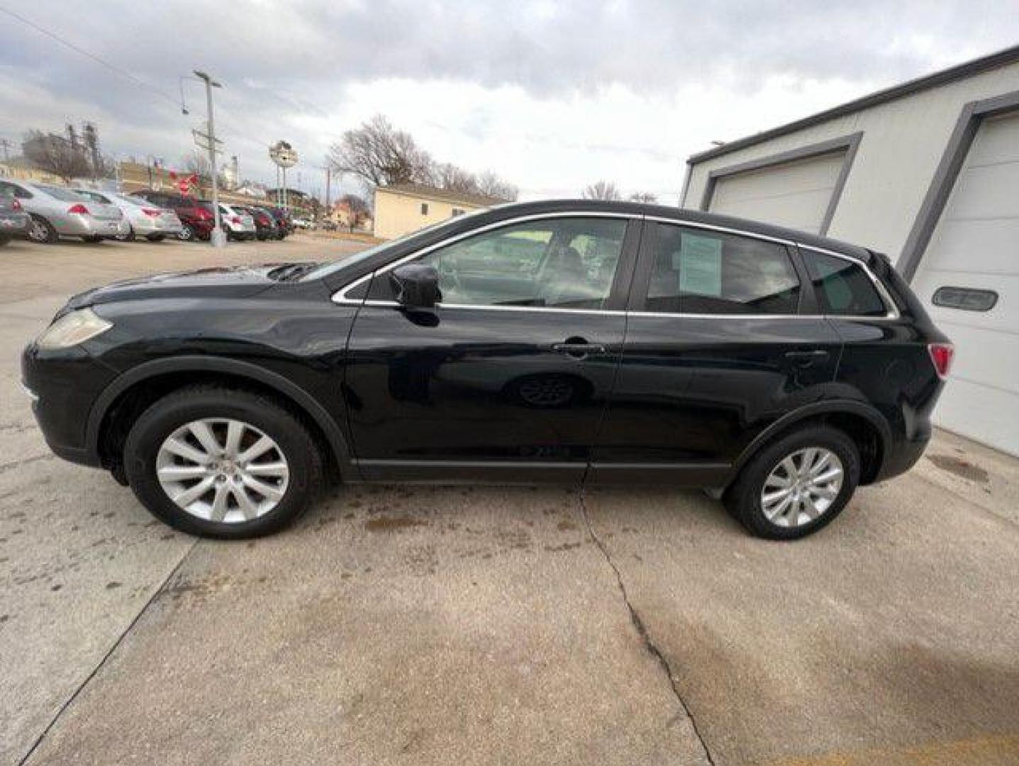 2012 BLACK MAZDA CX-9 SPORT (JM3TB3CA4C0) with an 3.7L engine, Automatic transmission, located at 1100 W. Sheridan Ave., Shenandoah, 51601, (712) 246-1600, 40.765678, -95.388817 - Photo#2
