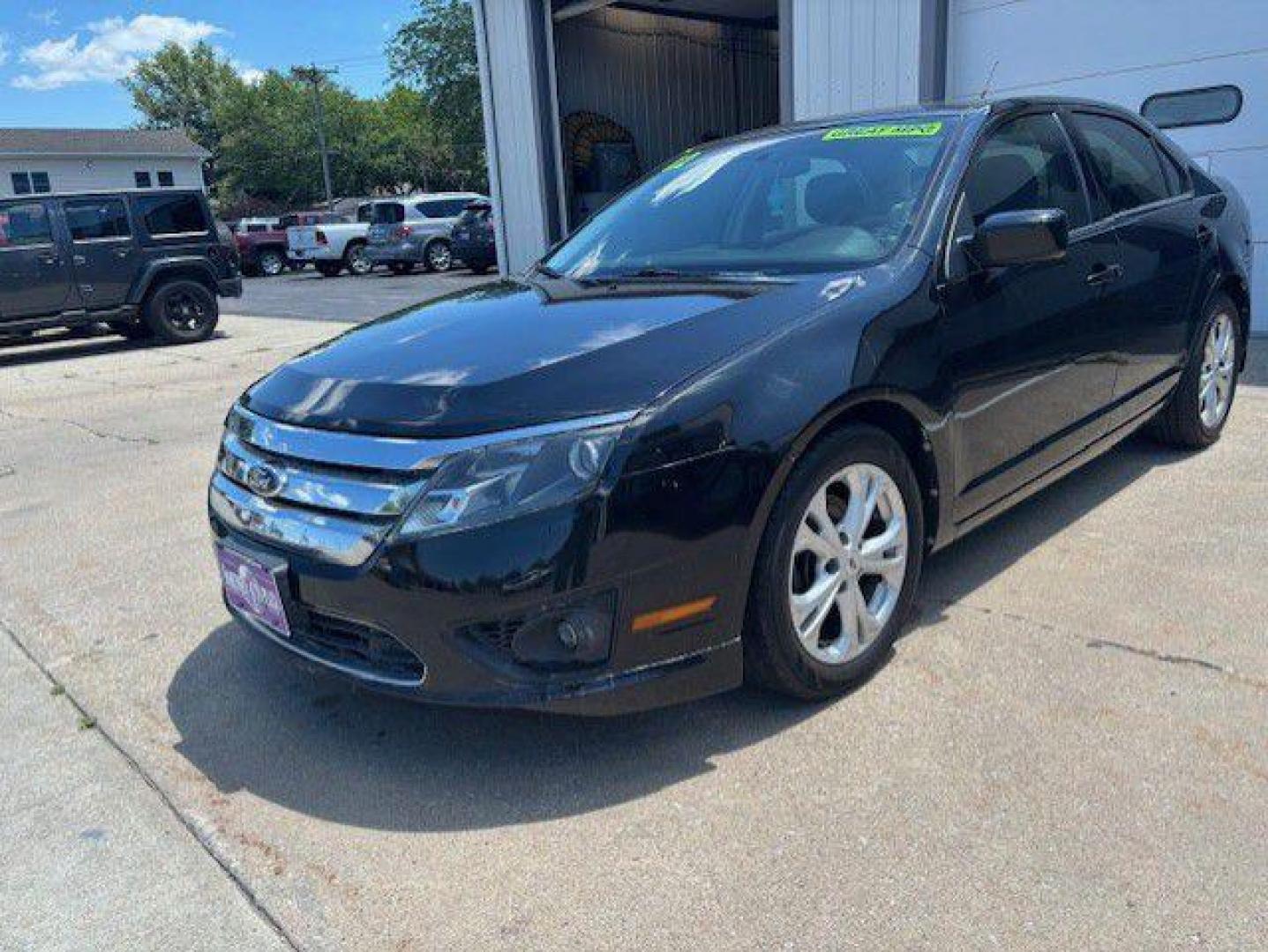 2012 BLACK FORD FUSION SE (3FAHP0HA6CR) with an 2.5L engine, Automatic transmission, located at 1100 W. Sheridan Ave., Shenandoah, 51601, (712) 246-1600, 40.765678, -95.388817 - Photo#0
