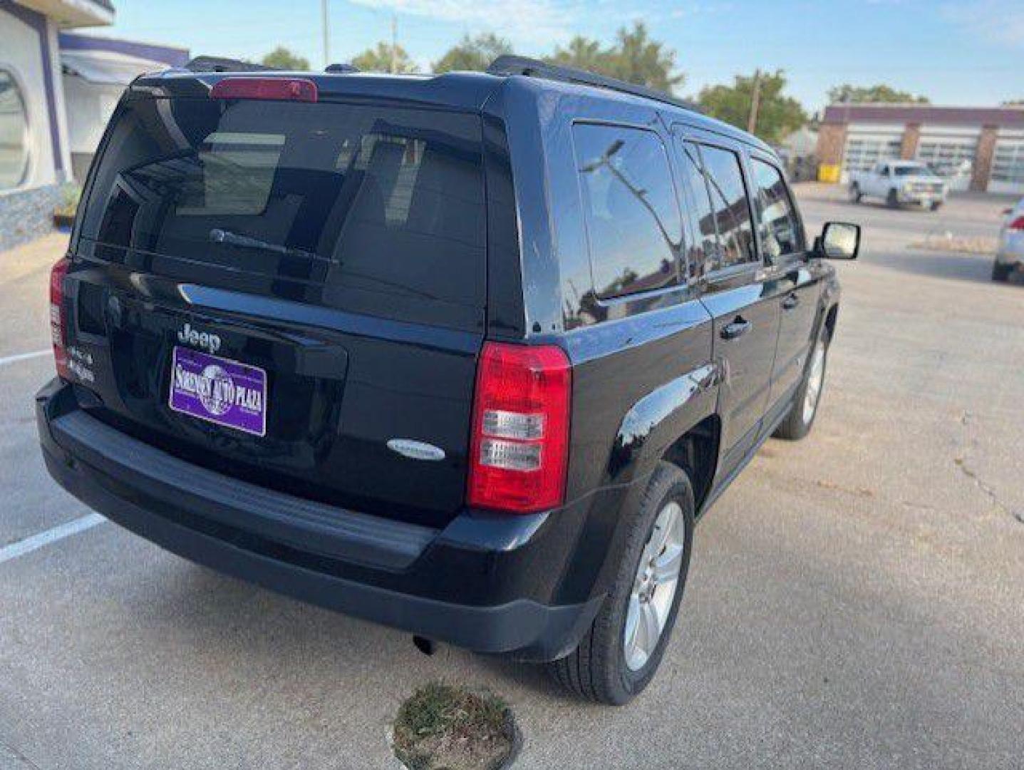 2013 BLACK JEEP PATRIOT LATITUDE (1C4NJRFB8DD) with an 2.4L engine, Continuously Variable transmission, located at 1100 W. Sheridan Ave., Shenandoah, 51601, (712) 246-1600, 40.765678, -95.388817 - Photo#6