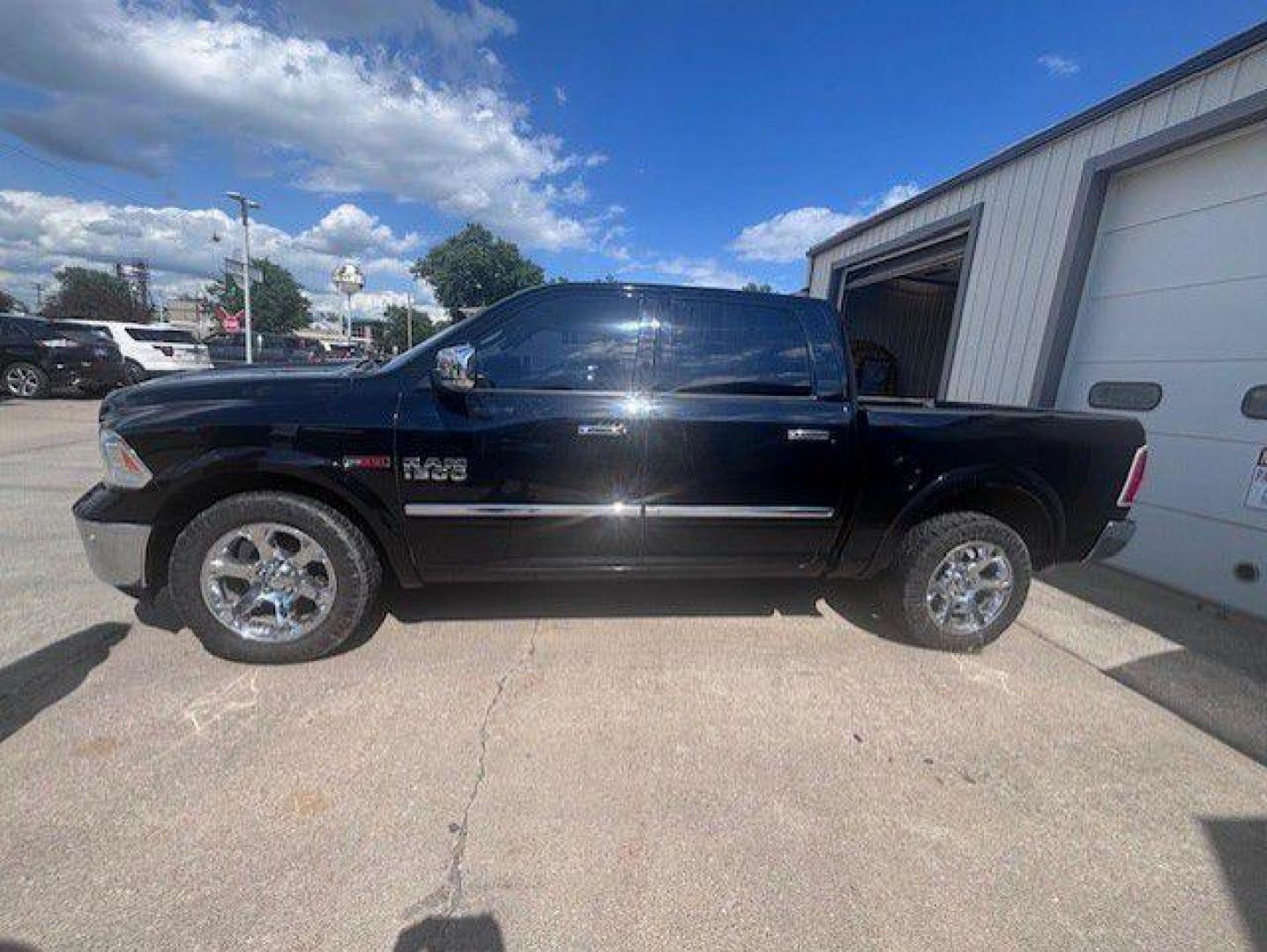 2015 BLACK RAM 1500 LARAMIE (1C6RR7NMXFS) with an 3.0L engine, Automatic transmission, located at 1100 W. Sheridan Ave., Shenandoah, 51601, (712) 246-1600, 40.765678, -95.388817- Photo#1