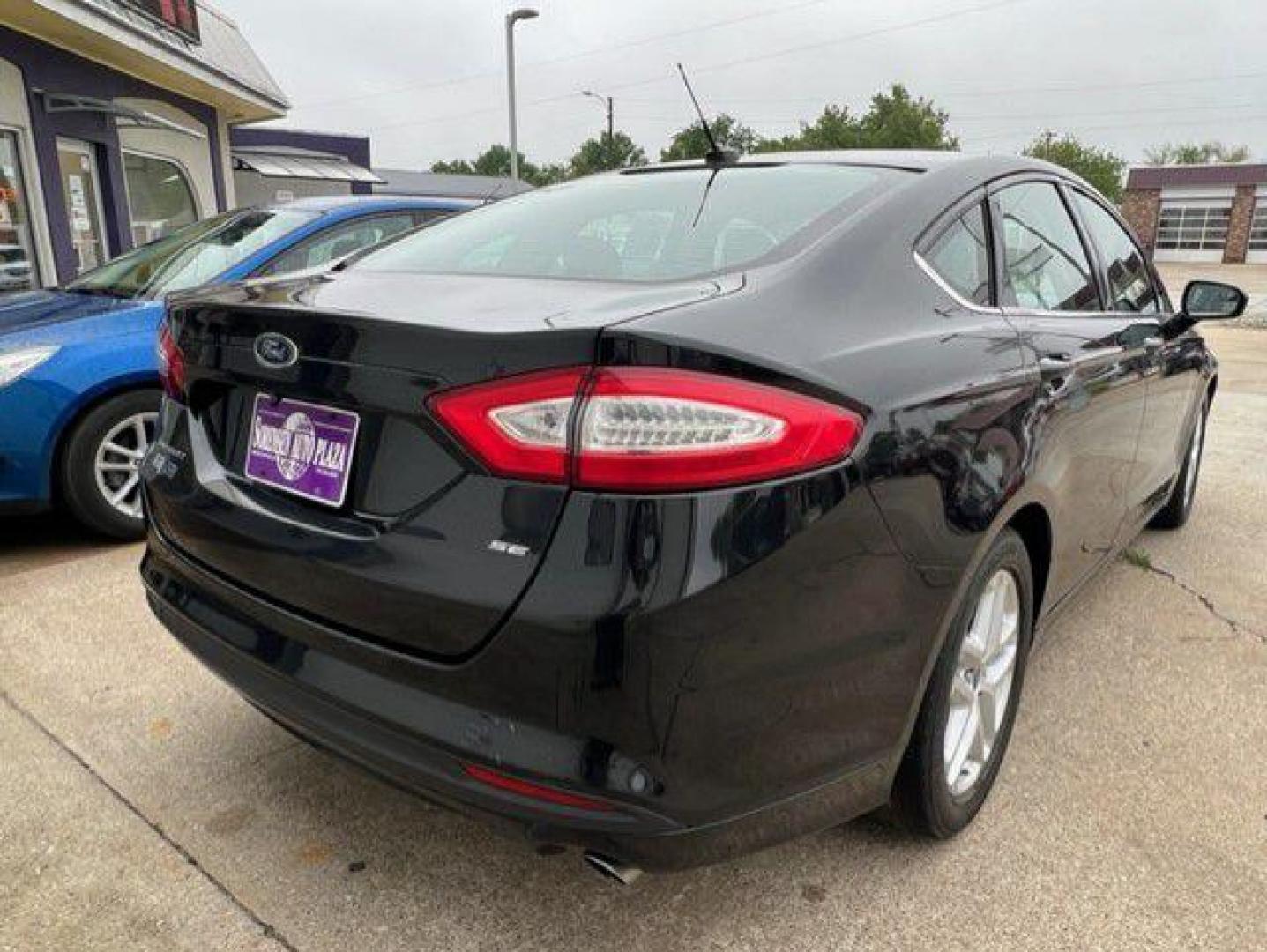 2015 BLACK FORD FUSION SE (1FA6P0H74F5) with an 2.5L engine, Automatic transmission, located at 1100 W. Sheridan Ave., Shenandoah, 51601, (712) 246-1600, 40.765678, -95.388817 - Photo#1
