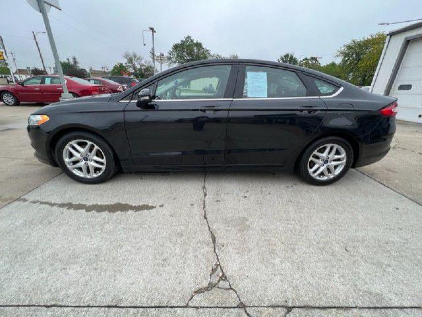 2015 BLACK FORD FUSION SE (1FA6P0H74F5) with an 2.5L engine, Automatic transmission, located at 1100 W. Sheridan Ave., Shenandoah, 51601, (712) 246-1600, 40.765678, -95.388817 - Photo#2