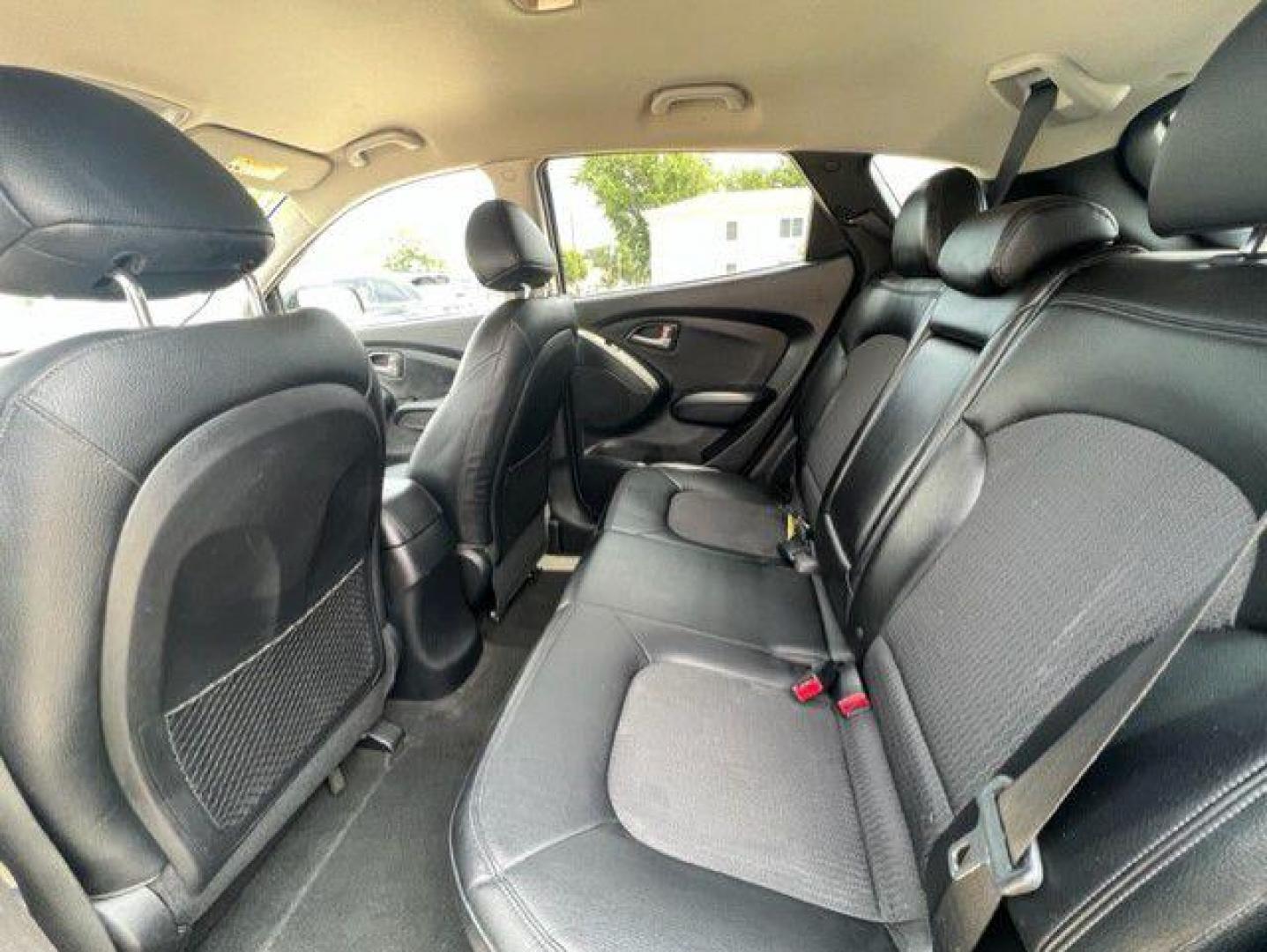 2010 BLACK HYUNDAI TUCSON GLS (KM8JUCAC9AU) with an 2.4L engine, Automatic transmission, located at 1100 W. Sheridan Ave., Shenandoah, 51601, (712) 246-1600, 40.765678, -95.388817 - Photo#4
